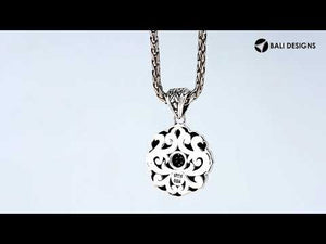 A wholesale sterling silver and 18K gold floral sunburst pendant featuring a diamond-studded center, intricate Balinese motifs, and oxidized two-tone detailing ideal for bulk jewelry orders.