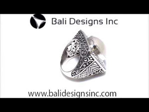 Wholesale sterling silver ring with bold square shank, featuring a large round white Mabe Pearl cabochon, accented with intricate oxidized Bali-style carvings, handcrafted artisan men’s statement jewelry.