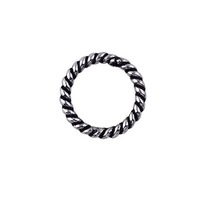 Handcrafted twisted closed jump ring in sterling silver with oxidized finish, artisan jewelry component from India.