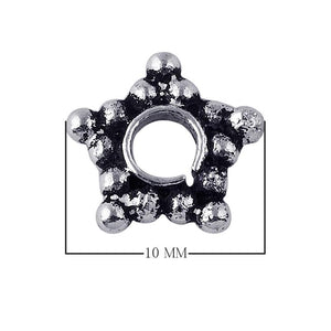 Star-shaped granulated spacer bead in silver overlay over copper with oxidized detailing and open circular center.