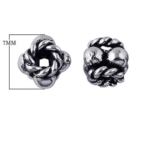 Silver Overlay Over Copper antique interwoven rope knot floral spacer jewelry component, handcrafted in India, shown in front and side view.