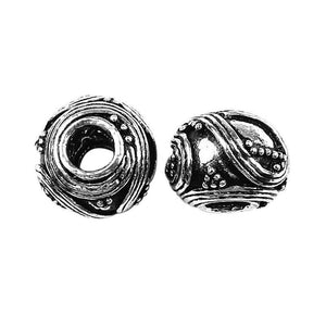 Handcrafted textured barrel spacer bead made with Silver Overlay Over Copper, wave and dotted detailing, artisan jewelry component from India.