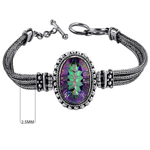 Sterling silver bracelet with oval faceted Mystic Quartz , handcrafted in Bali with Balinese chain and bead accents – wholesale gemstone jewelry supplier.