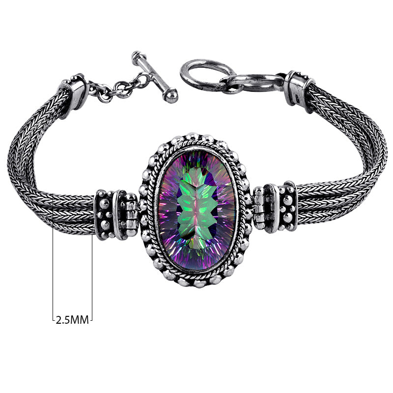 Sterling silver bracelet with oval faceted Mystic Quartz , handcrafted in Bali with Balinese chain and bead accents – wholesale gemstone jewelry supplier.