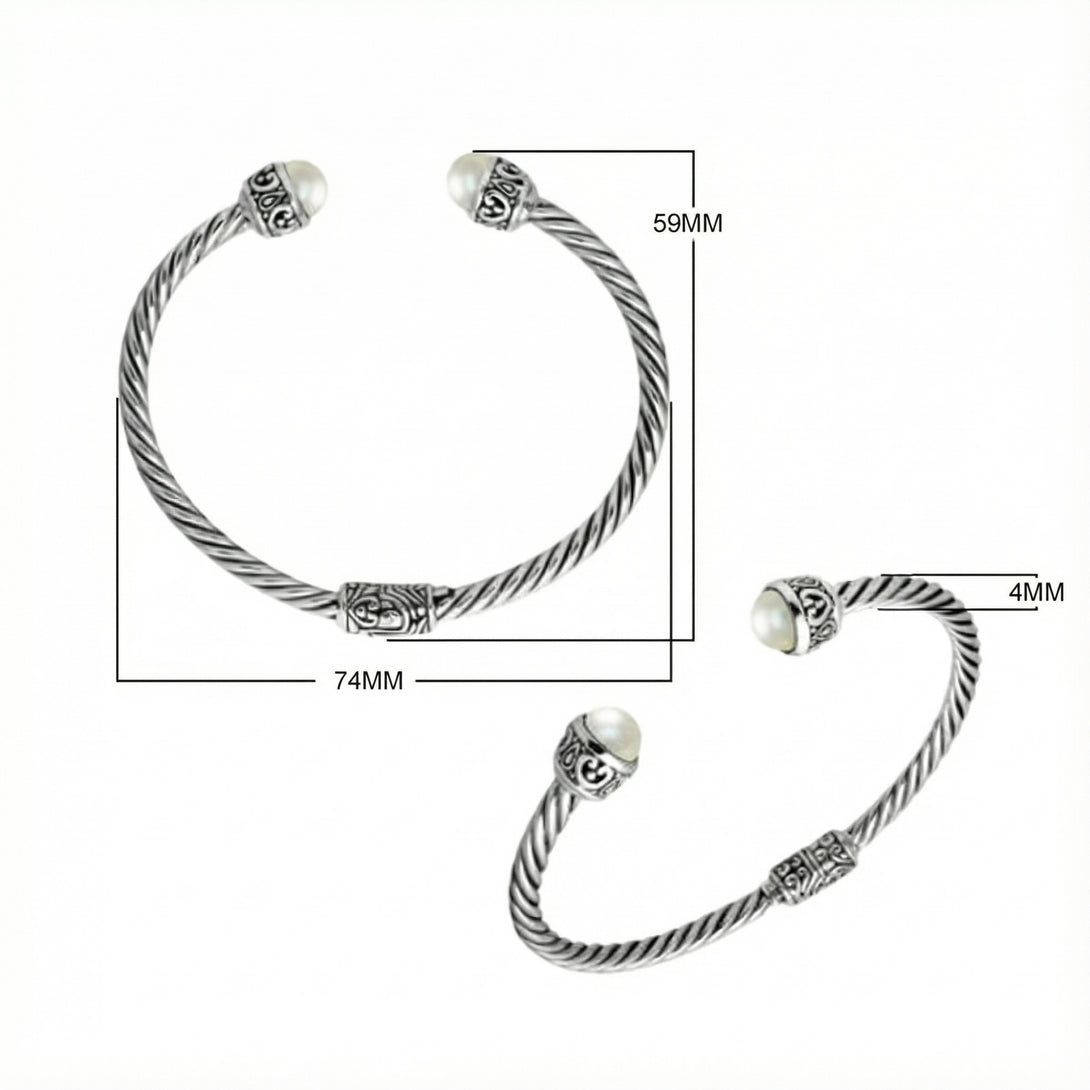 Wholesale sterling silver Pearl bangle with twisted rope design, oxidized finish, and Balinese motifs, handcrafted in Bali.