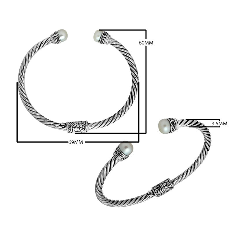 Wholesale sterling silver Pearl bangle with twisted rope design, Balinese motifs, and oxidized finish, handcrafted in Bali.