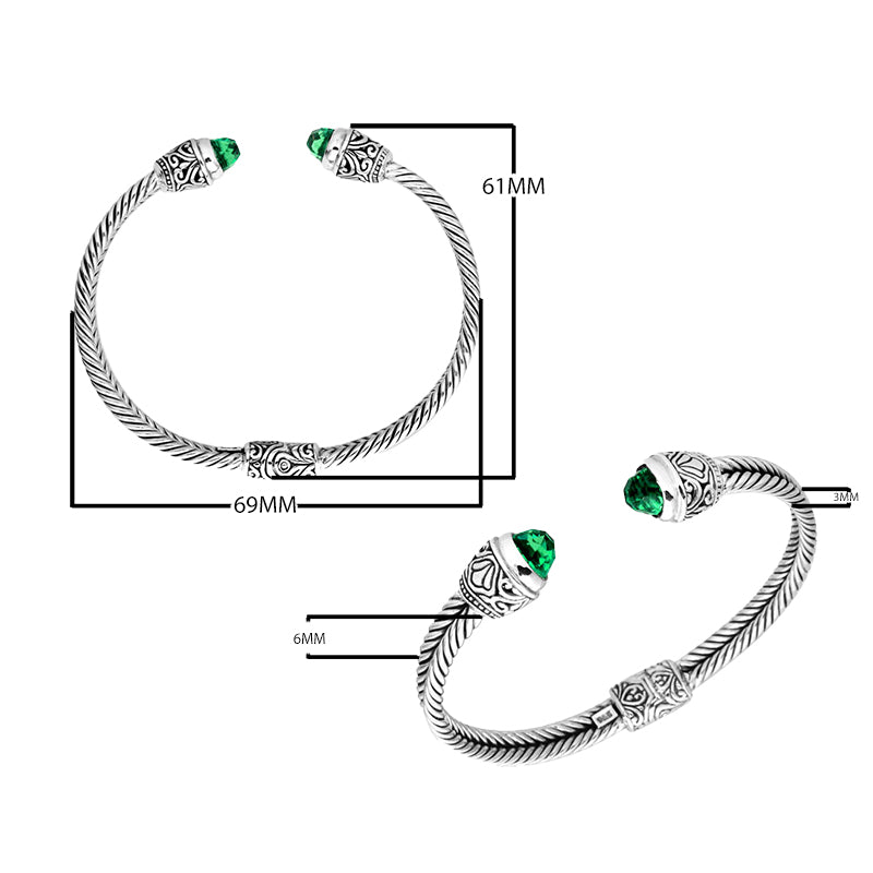 Sterling silver wholesale bangle with twisted rope design, Green Quartz end caps, and Balinese handcrafted details.
