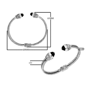 Sterling silver wholesale bangle with twisted rope design, finished with Black Onyx end caps and Balinese detailing.