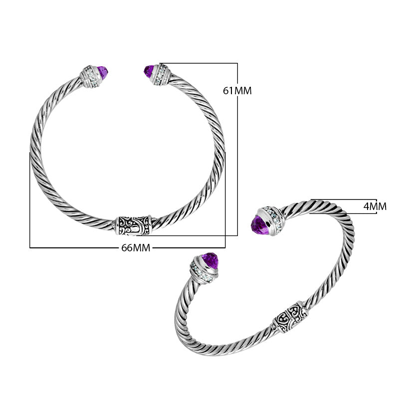 Sterling silver wholesale bangle with twisted rope design, Black Onyx and Cubic Zirconia accents, handcrafted Balinese motifs.