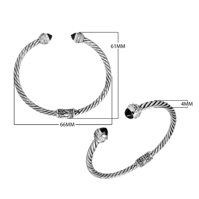 Sterling silver wholesale bangle with twisted rope design, Black Onyx and Cubic Zirconia accents, handcrafted Balinese motifs.