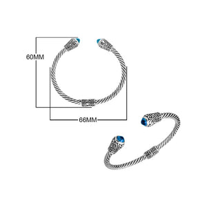 Sterling silver twisted bangle with Blue Topaz quartz ends and Balinese carvings, handcrafted in Bali