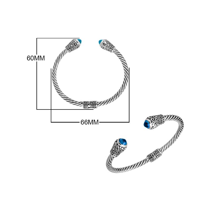 Sterling silver twisted bangle with Blue Topaz quartz ends and Balinese carvings, handcrafted in Bali