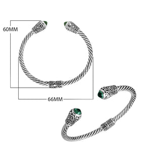 Sterling silver twisted bangle with green quartz ends and Balinese carvings, handcrafted in Bali
