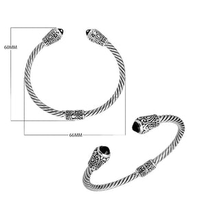 Sterling silver twisted bangle with black onyx ends and Balinese carvings, handcrafted in Bali