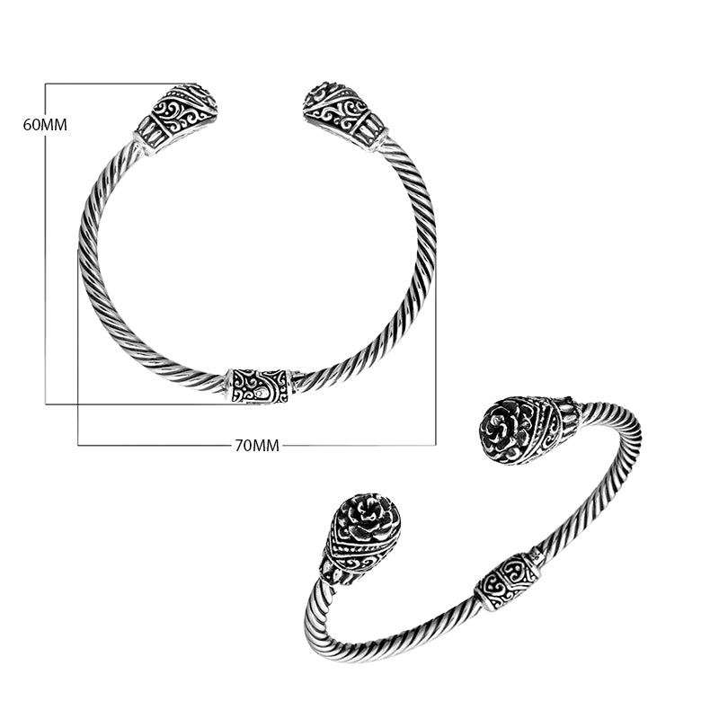 Sterling silver twisted bangle with Balinese carved ends, handcrafted in Bali