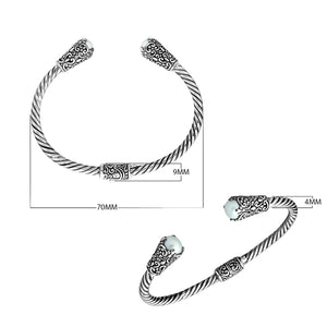 Sterling silver twisted bangle with pearl ends and Balinese carvings, handcrafted in Bali