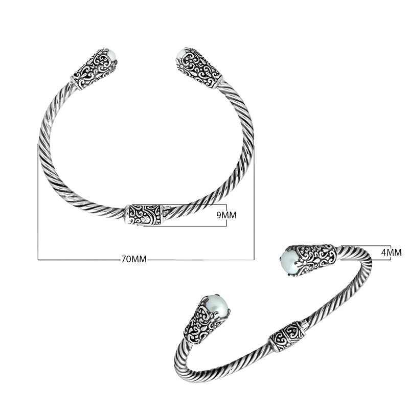 Sterling silver twisted bangle with pearl ends and Balinese carvings, handcrafted in Bali
