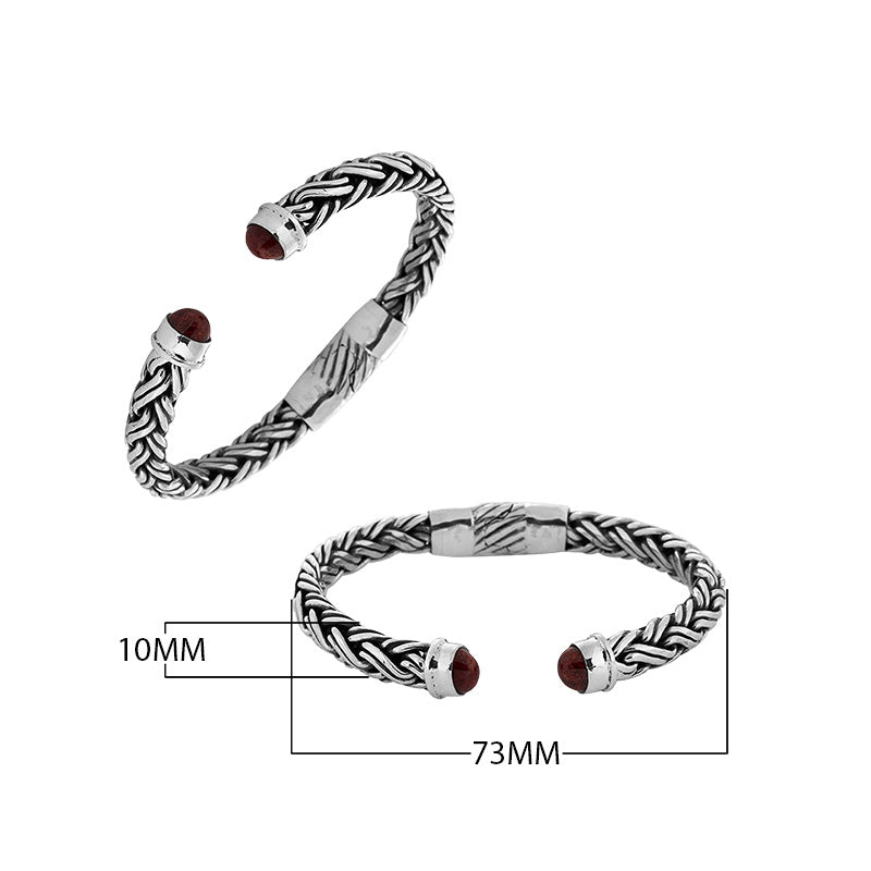Sterling silver braided bangle with Coral ends handcrafted in Bali for wholesale jewelry collections.