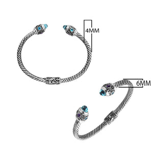 Sterling silver twisted bangle with Amethyst Quartz and Blue Topaz Quartz handcrafted in Bali.
