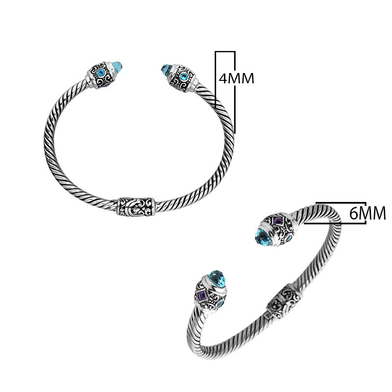 Sterling silver twisted bangle with Amethyst Quartz and Blue Topaz Quartz handcrafted in Bali.