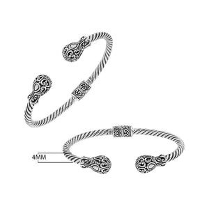 Sterling silver twisted bangle with ornate Balinese end design and oxidized finish