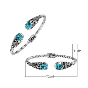Sterling silver twisted bangle with blue topaz quartz ends and Balinese oxidized detailing