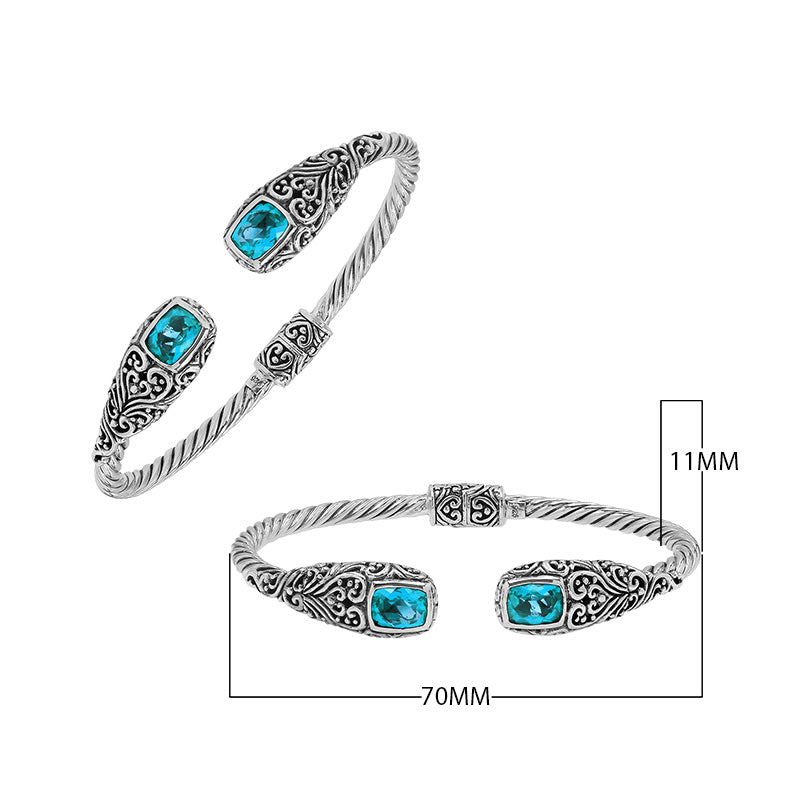 Sterling silver twisted bangle with blue topaz quartz ends and Balinese oxidized detailing