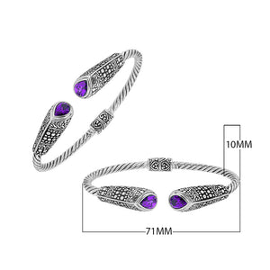 Sterling silver twisted bangle with amethyst quartz ends and Balinese oxidized dot pattern