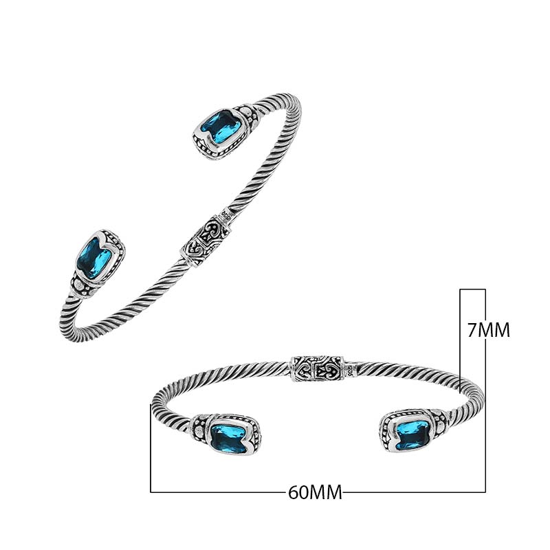 Silver twisted cable bangle in 925 sterling silver with Blue Topaz Quartz and ornate Balinese engraving.