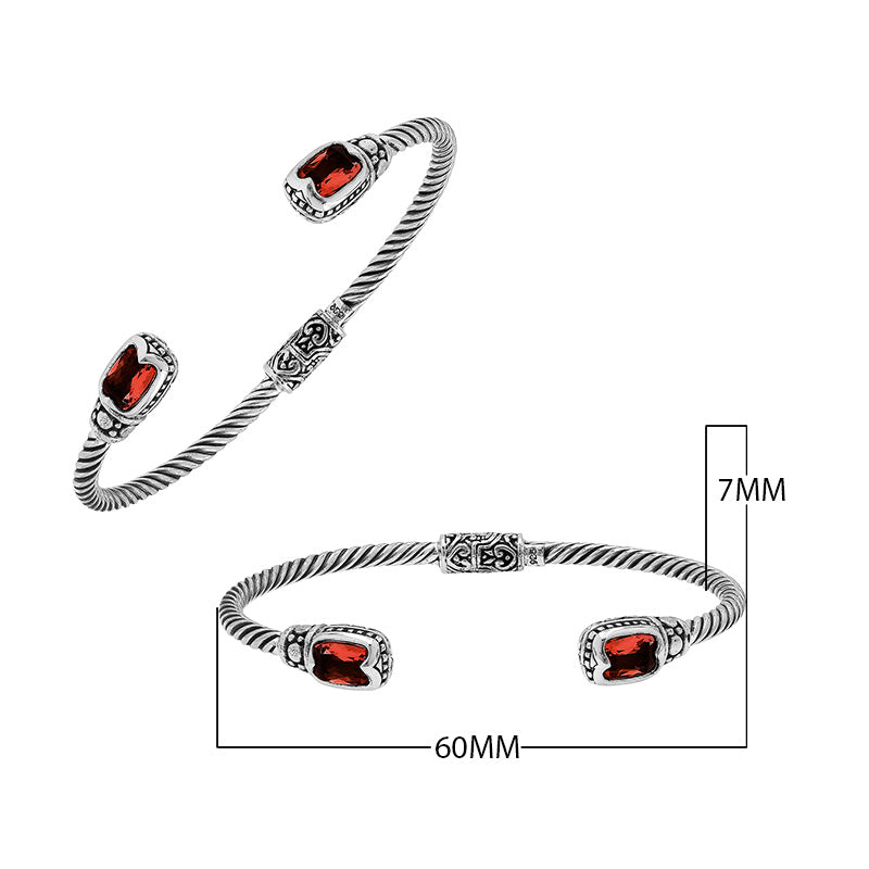 Silver twisted cable bangle in 925 sterling silver with Garnet Quartz ends and Balinese engraving.