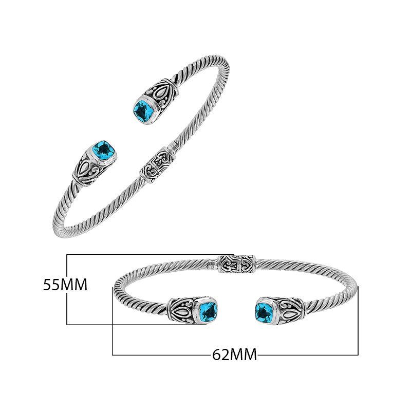 Silver twisted cable bangle in 925 sterling silver with Blue Topaz Quartz ends and Balinese engraving.