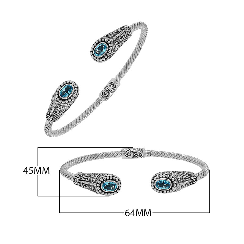 Silver twisted cable bangle in 925 sterling silver with Blue Topaz Quartz ends and Balinese engraving.