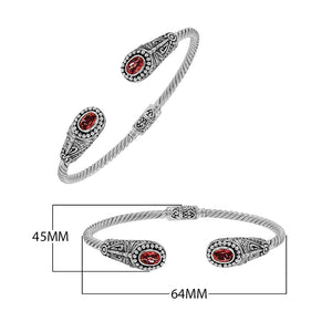 Silver twisted cable bangle in 925 sterling silver with Garnet Quartz ends and Balinese engraving.