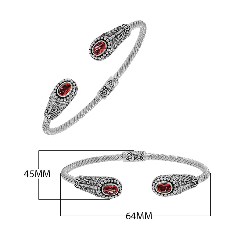 Silver twisted cable bangle in 925 sterling silver with Garnet Quartz ends and Balinese engraving.