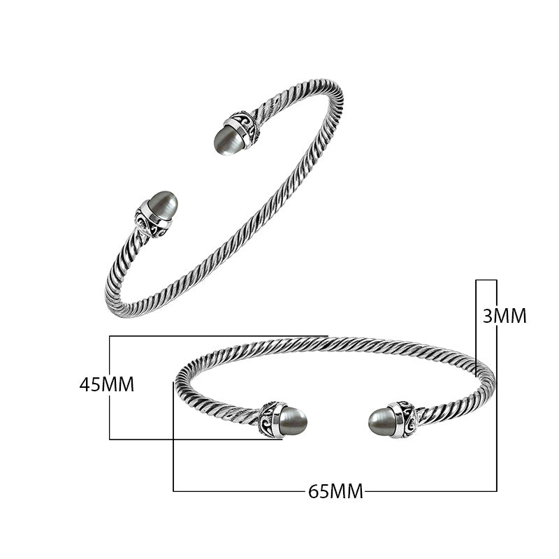 Sterling Silver Twisted Cable Bangle With Gray Mabe Pearls and Tribal Oxidized Detailing For Wholesale Buyers.