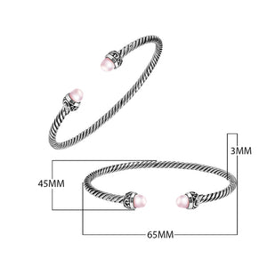 Sterling Silver Twisted Cable Bangle With Pink Freshwater Pearls and Tribal Oxidized Detailing For Wholesale Buyers.