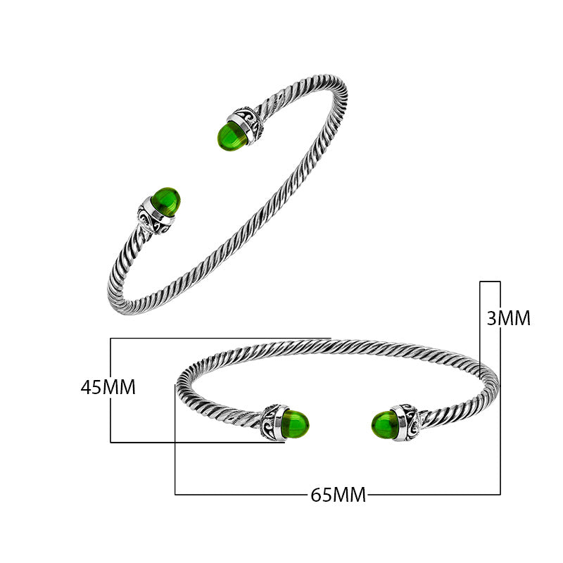 Sterling Silver Twisted Cable Bangle With Green Peridot Quartz and Oxidized Tribal Detailing For Wholesale Buyers.