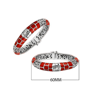 Sterling silver hinged bangle with red coral inlay and intricate filigree design handcrafted in Bali.
