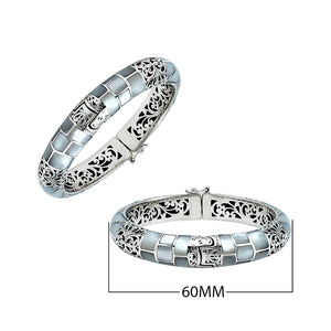 Sterling silver hinged bangle with mother of pearl inlay and intricate filigree design handcrafted in Bali.
