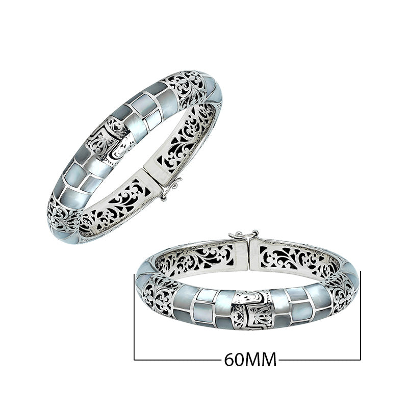 Sterling silver hinged bangle with mother of pearl inlay and intricate filigree design handcrafted in Bali.