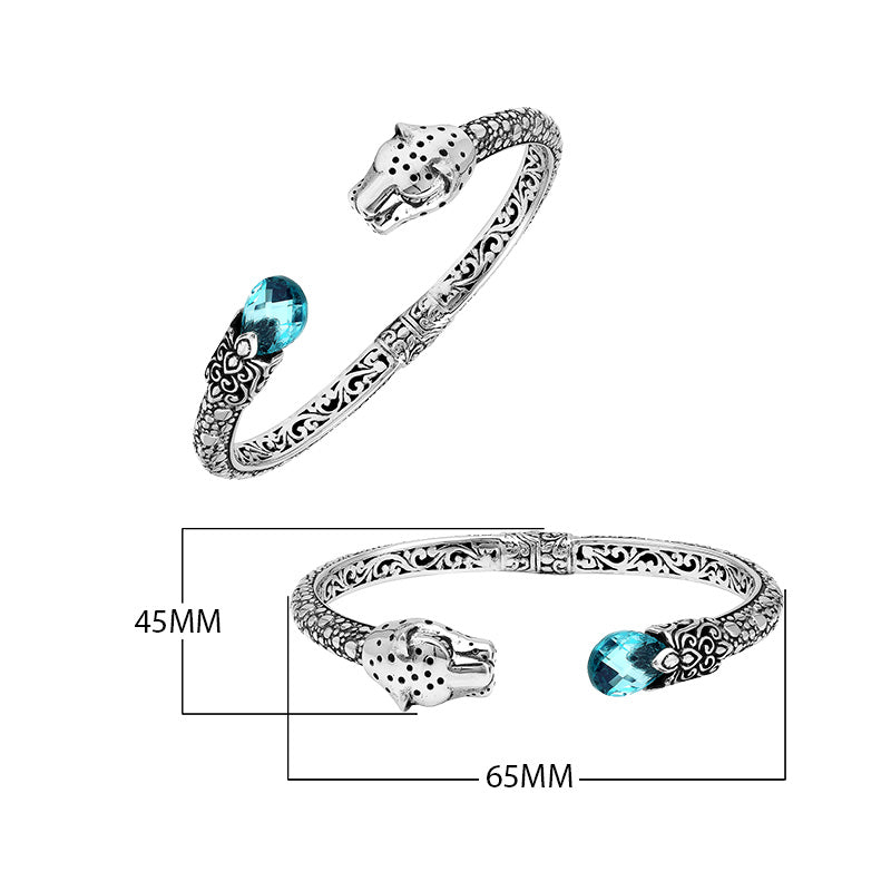 Sterling silver panther head cuff bangle with blue topaz quartz ends and floral carving handcrafted in Bali.