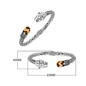 Sterling silver panther head cuff bangle with citrine quartz ends and floral carvings handcrafted in Bali.