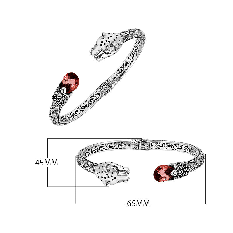 Sterling silver panther head cuff bangle with garnet quartz ends and intricate floral carvings handcrafted in Bali.