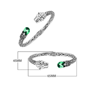 Sterling silver panther head cuff bangle with green quartz ends and floral detailing handcrafted in Bali.