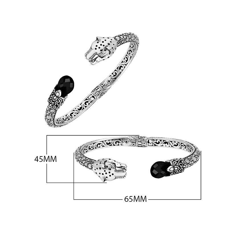 Sterling silver panther head cuff bangle with black onyx ends and floral detailing handcrafted in Bali.