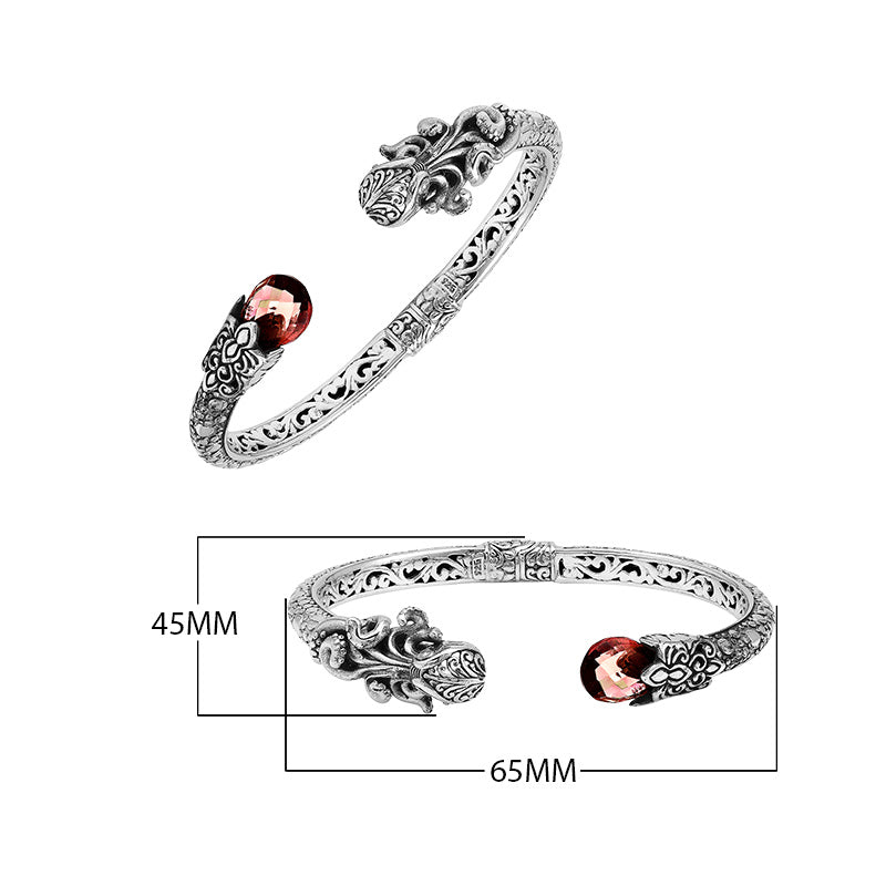 Sterling silver dragon head cuff bangle with garnet quartz ends and floral carvings handcrafted in Bali.