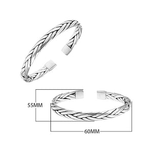 A wholesale sterling silver large woven bangle featuring bold Balinese textures, polished detailing, and a secure hinge lock, ideal for premium bulk jewelry purchasing.