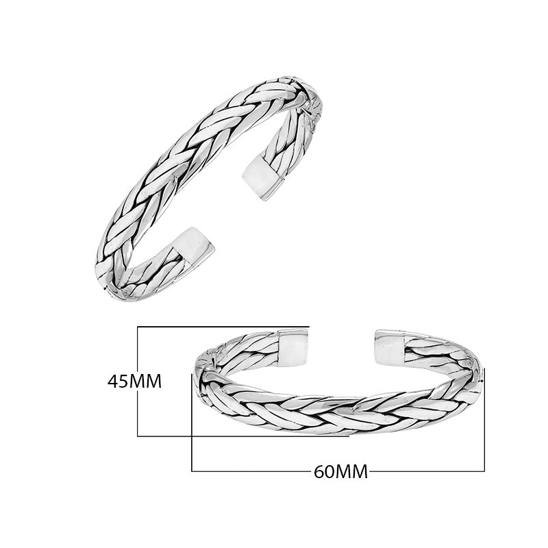 A wholesale sterling silver small woven bangle featuring polished Balinese textures, smooth finishing, and a secure hinge lock perfect for lightweight premium jewelry collections.