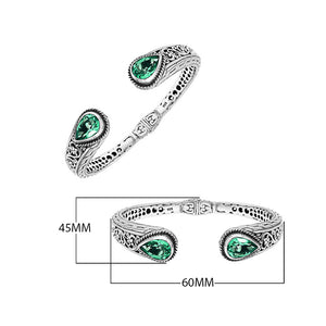 Wholesale sterling silver hinge-lock cuff with green quartz teardrop stones and Balinese engravings.