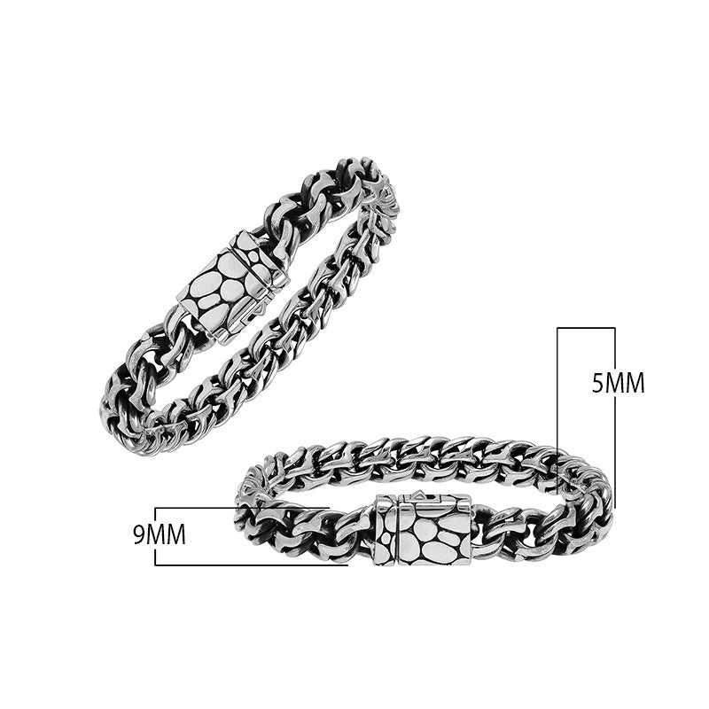 A wholesale sterling silver heavy woven bracelet featuring a textured push clasp, polished and oxidized detailing, and rugged craftsmanship designed for premium bulk jewelry collections.